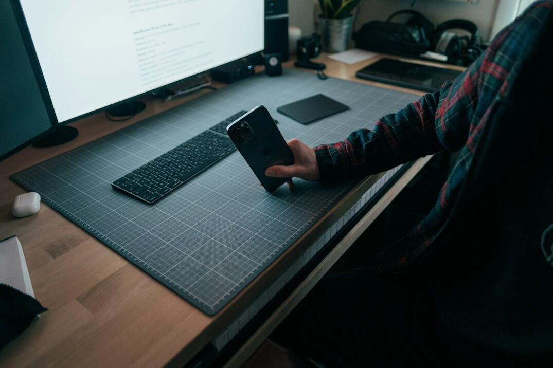 person coding at desk